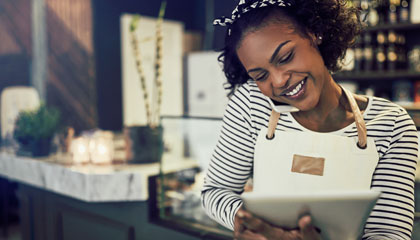 A woman looking at a tablet